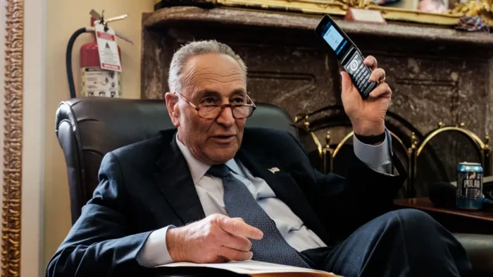 A senator using a flip phone