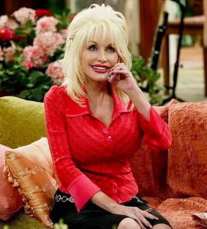 Dolly Parton on a flip phone